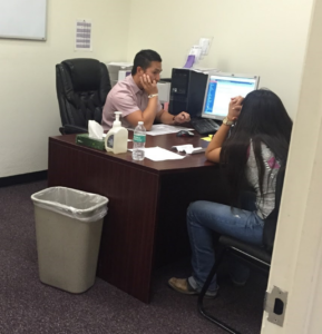 Mr. Chang providing class change assistance for Jazmin Torres and her college pathway.
